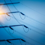 High voltage tower isolated on sky,blue toned.